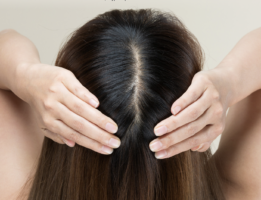 Woman pulling hair back